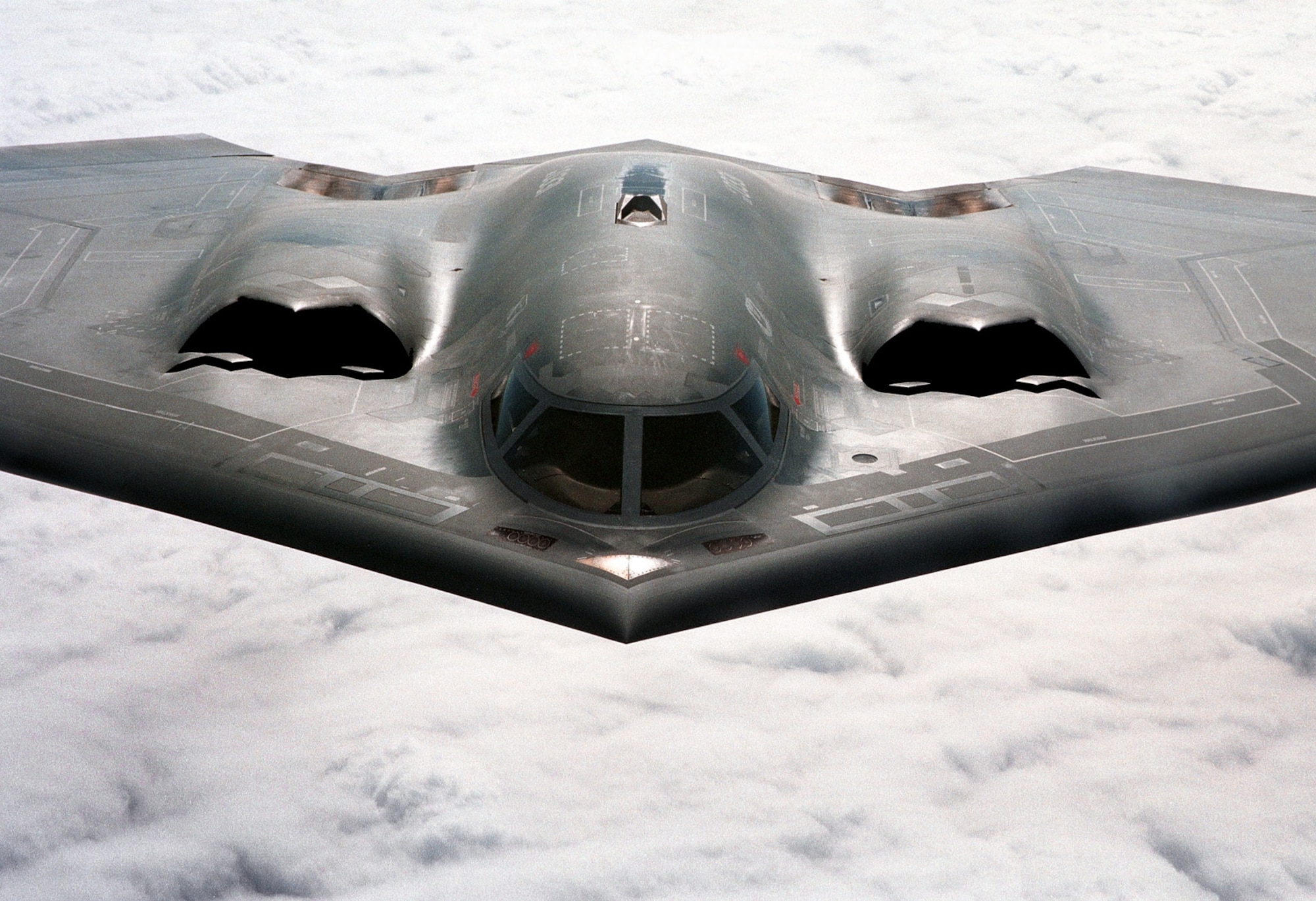 OVER KANSAS -- The B-2 Spirit bomber is a revolutionary blending of low-observable technologies with high aerodynamic efficiency and large payload gives the B-2 important advantages over existing bombers. Its unrefueled range is approximately 6,000 nautical miles. Many aspects of the low-observability process remain classified; however, the B-2's composite materials, special coatings and flying-wing design all contribute to its "stealthiness." (U.S. Air Force photo by Staff Sgt. Mark Olsen)

