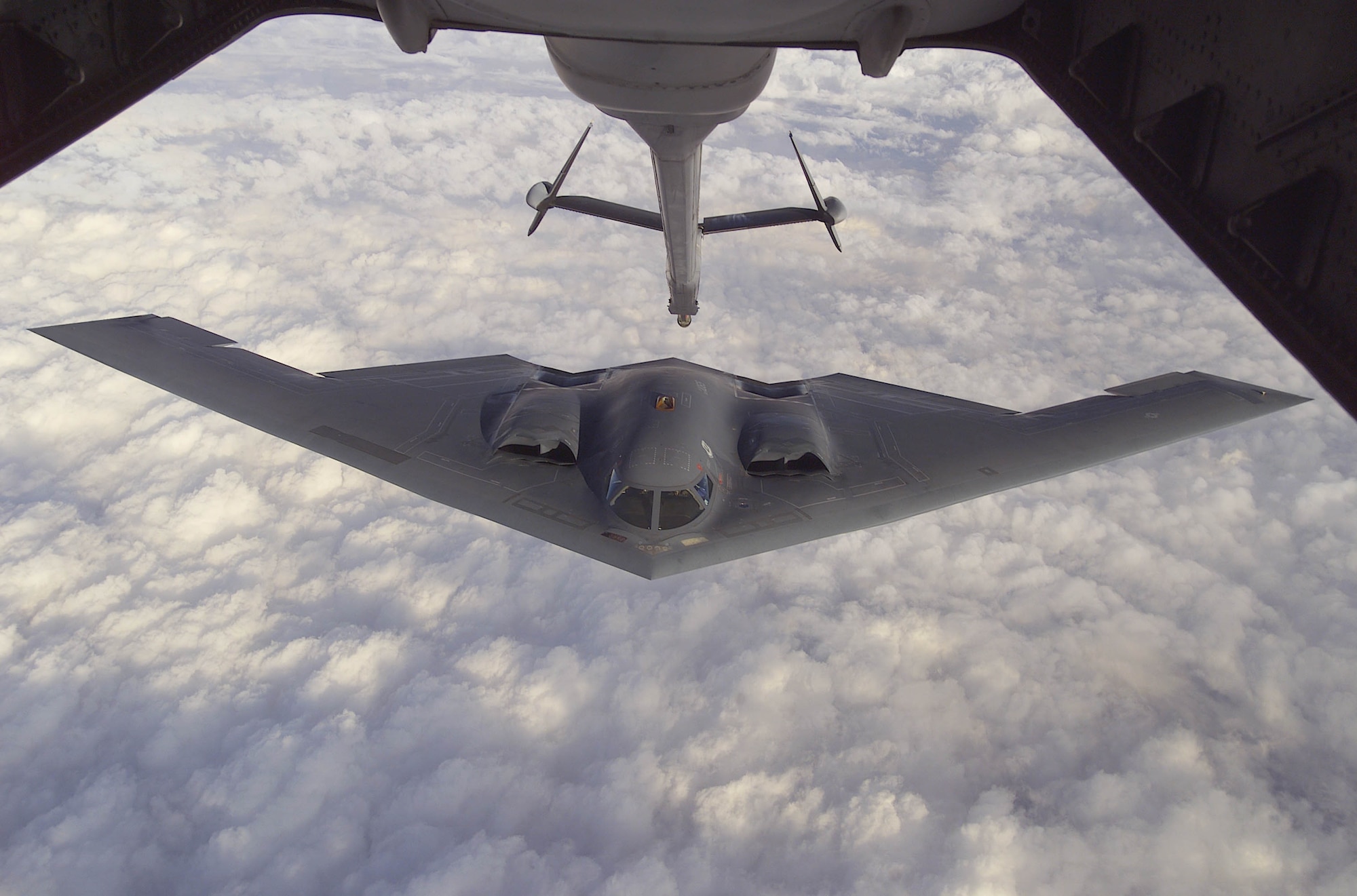 FILE PHOTO -- The B-2 Spirit approaches the boom of a McGuire Air Force Base, New Jersey KC-10A Extender during a Capstone orientation flight. Capstone is a Joint Airborne/Air Transportability Training mission providing interservice training for the wartime application of airlift. Through Capstone, senior level officers are able to observe the significance of airlift and its role in all military operations. (U.S. Air Force photo by Staff Sgt. Scott H. Spitzer)