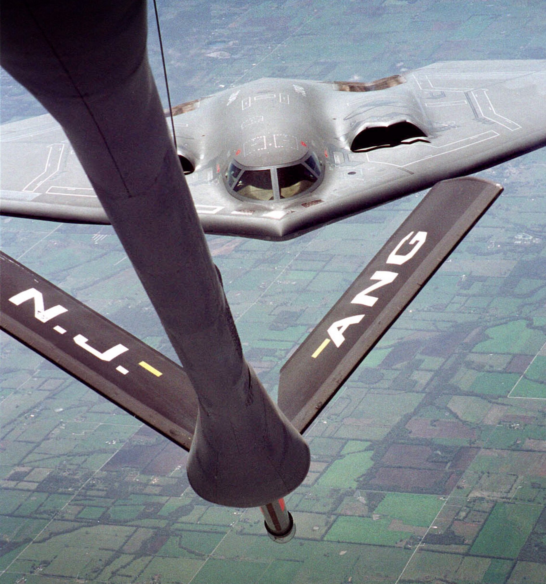 FILE PHOTO -- A B-2 Spirit from Whiteman Air Force Base, Mo. pulls up for a fill-up with a KC-135 Stratotanker of New Jersey's 108th Air Refueling Wing, Air National Guard over Kansas farmland. The KC-135 Stratotanker's principal mission is air refueling. This asset greatly enhances the U. S. Air Force's capability to accomplish its mission of Global Engagement. (U.S. Air Force photo by Staff Sgt. Mark Olsen)
