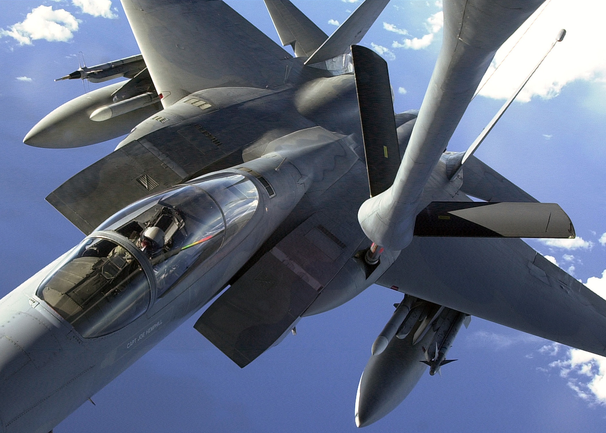 OVER THE PACIFIC OCEAN -- An F-15C from the 67th Fighter Squadron refuels in flight from a KC-135R, from the 909th Air Refueling Squadron, June 28, 2001, while on a routine training mission over the Pacific ocean.  Both units are stationed at Kadena Air Base, Japan.  (U.S. Air Force photo by Master Sgt. Marvice Krause)