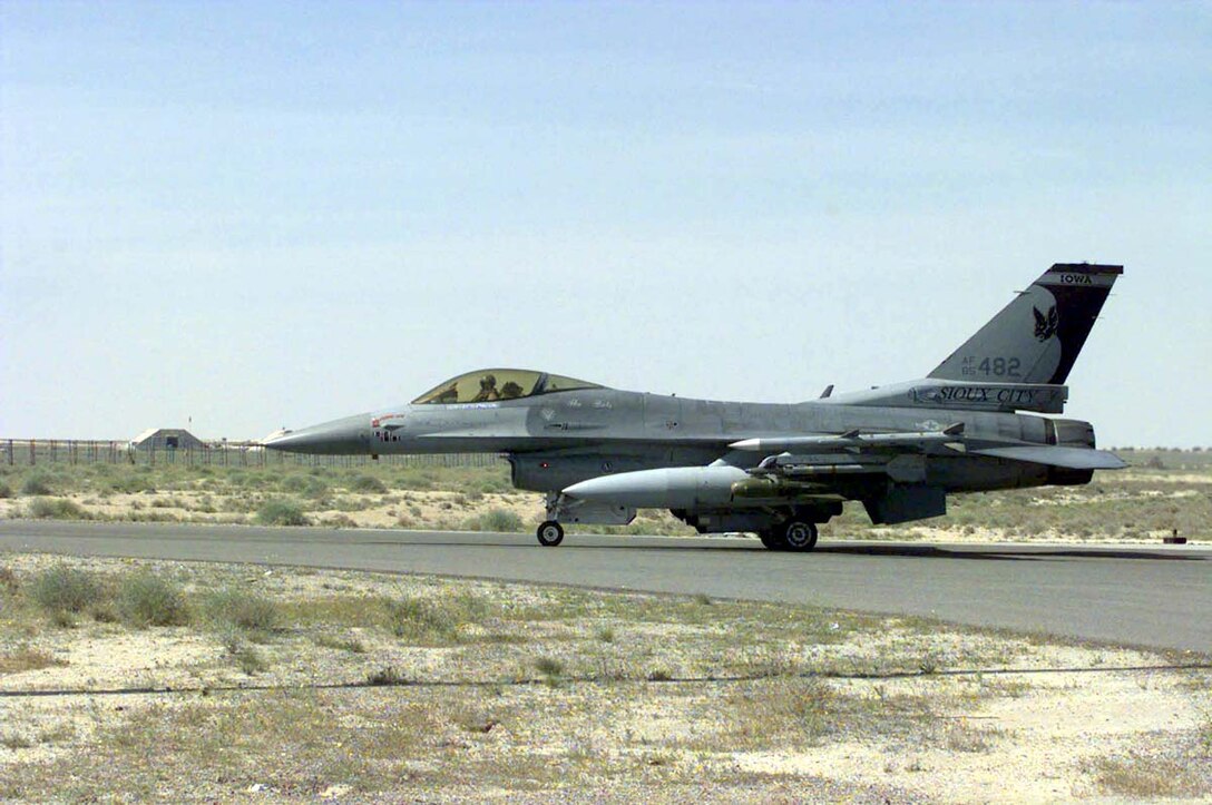 AHMED AL JABER AIR BASE, Kuwait -- An F-16 Fighting Falcon from the 114th Fighter Wing, Joe Foss Field, Sioux Falls, S.D., taxis out on the runway here. (U.S. Air Force photo by Master Sgt. Val Gempis)