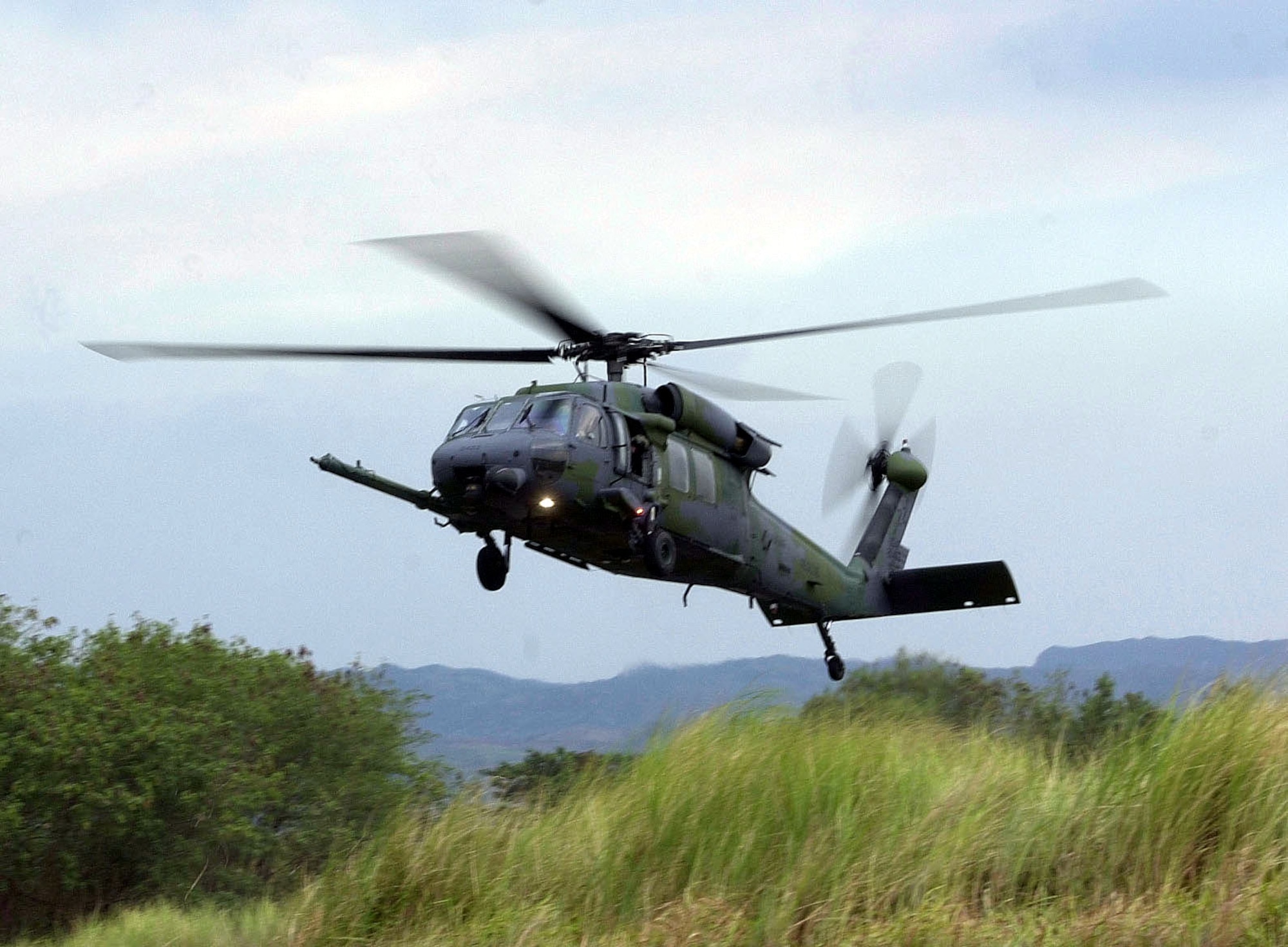 BASA AIR BASE, Philippines -- An HH-60 Pave Hawk helicopter from the 33rd Rescue Squadron, Kadena Air Base, Japan, lands at here to evacuate "injured" personnel from a cargo aircraft "accident" during a joint US/Philippine mass casualty exercise during Balikatan 2001. (U.S. Air Force photo by Master Sgt. Val Gempis)
