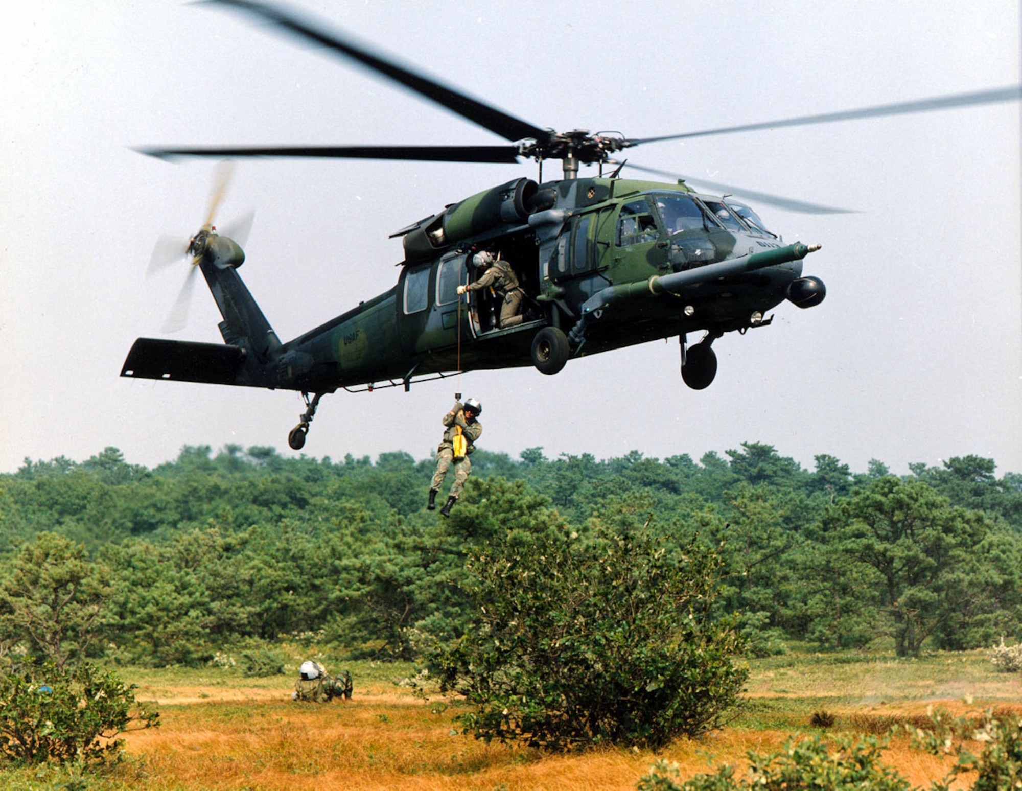 FILE PHOTO -- The primary mission of the HH-60G Pave Hawk helicopter is to conduct day or night operations into hostile environments to recover downed aircrew or other isolated personnel during war. Because of its versatility, the HH-60G is also tasked to perform military operations other than war. These tasks include civil search and rescue, emergency aeromedical evacuation, disaster relief, international aid, counterdrug activities and NASA space shuttle support.
(U.S. Air Force Photo) 