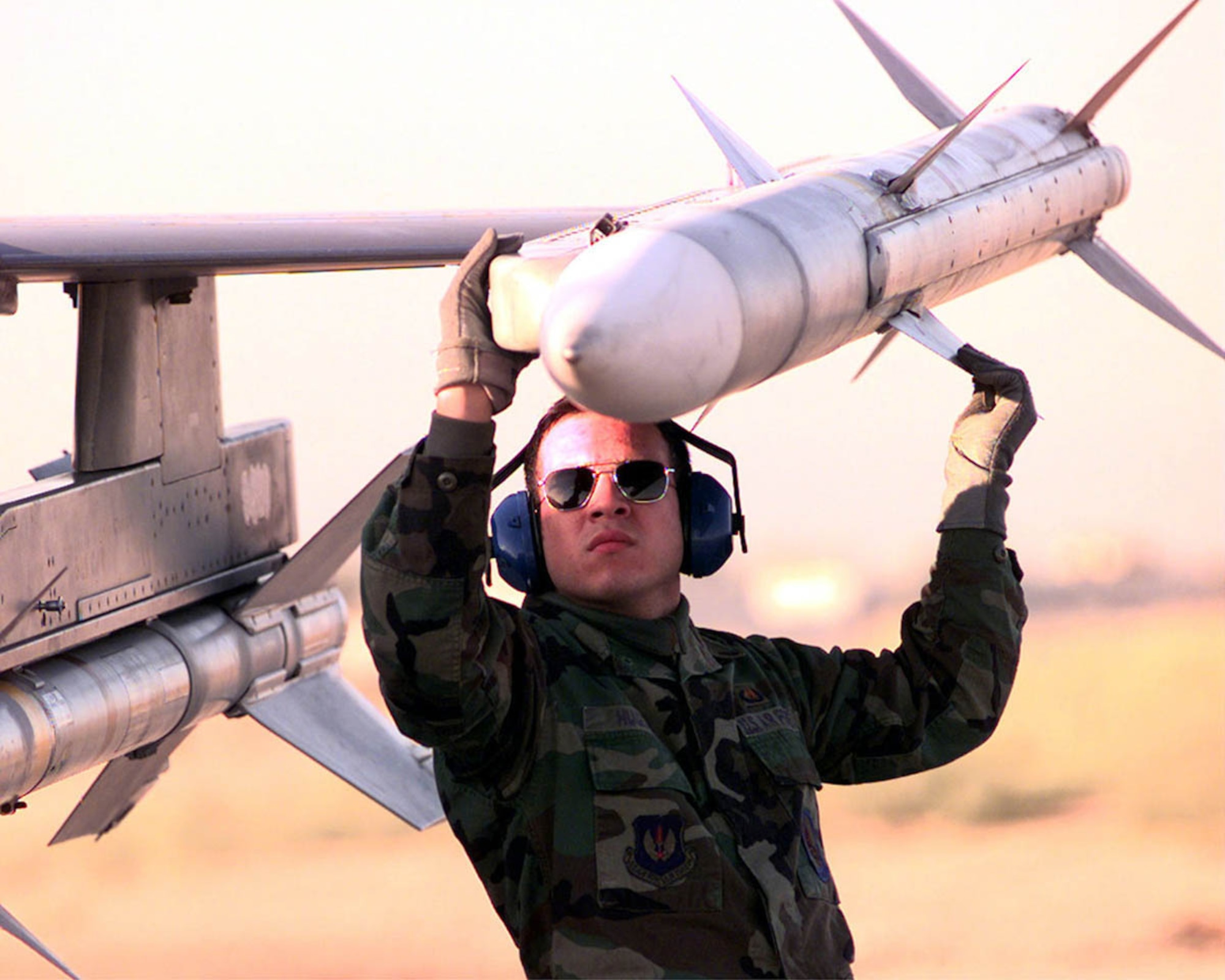 OPERATION NORTHERN WATCH -- Armament technician Senior Airman Hector Huguet of the 23rd Expeditionary Fighter Squadron checks a missile on an F-16CJ Fighting Falcon before takeoff from Incirlik Air Base, Turkey, as part of Operation Northern Watch. The operation involves patrolling the northern no-fly zones of Iraq. (U.S. Air Force photo by Staff Sgt. Vincent A. Parker) 
