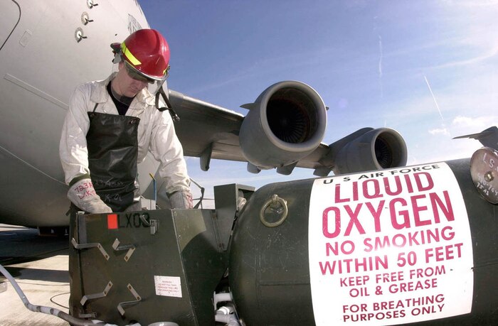 RAMSTEIN AIR BASE, Germany -- Staff Sgt. Donald Nykamp from the 437th Aircraft Generation Squadron at Charleston Air Force Base, S.C., services liquid oxygen into a C-17 Globemaster III on Oct. 11. C-17s are being used to airdrop humanitarian daily rations over Afghanistan as part of Operation Enduring Freedom. (U.S. Air Force photo by Senior Airman Latonia L. Brown)