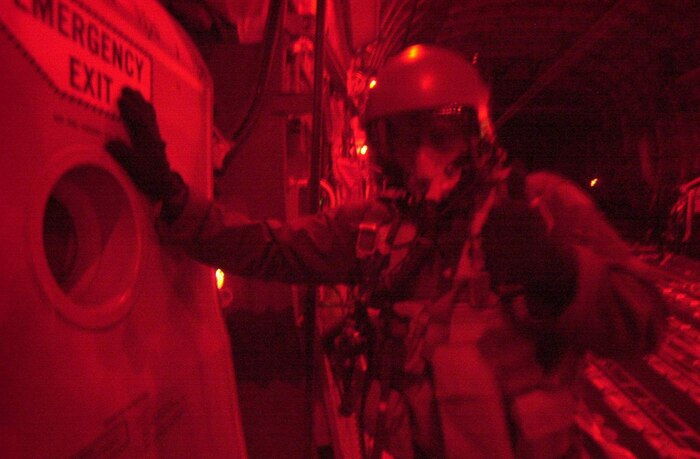 OPERATION ENDURING FREEDOM -- U.S. Air Force crew members from Charleston Air Force Base, S.C., continue high altitude drops of HDRs (Humanitarian Daily Rations) from their C-17 Globemaster III somewhere over northern Afghanistan, Oct. 18, 2001. The C-17 dropped 42 TRIADS containing 17,220 HDRs. More than 500,000 HDRs have been dropped into Afghanistan since the humanitarian relief effort began. (U.S. Air Force photo by Mannie Garcia/Gannett/ATPCo) 