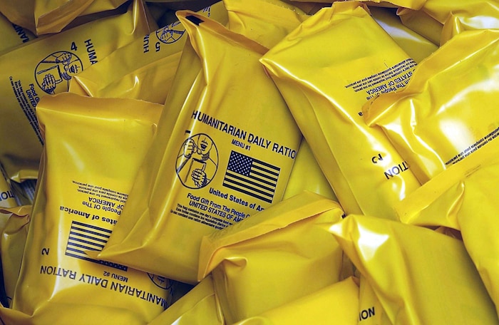 OPERATION ENDURING FREEDOOM -- Humanitarian daily rations were containerized and placed on board a C-17 Globemaster III on Oct. 4, 2001 at Ramstein Air Base, Germany. The humanitarian supplies were airdropped Oct. 7 over eastern Afghanistan as part of Operation Enduring Freedom. (U.S. Air Force photo by Staff Sgt. Jeremy T. Lock)
