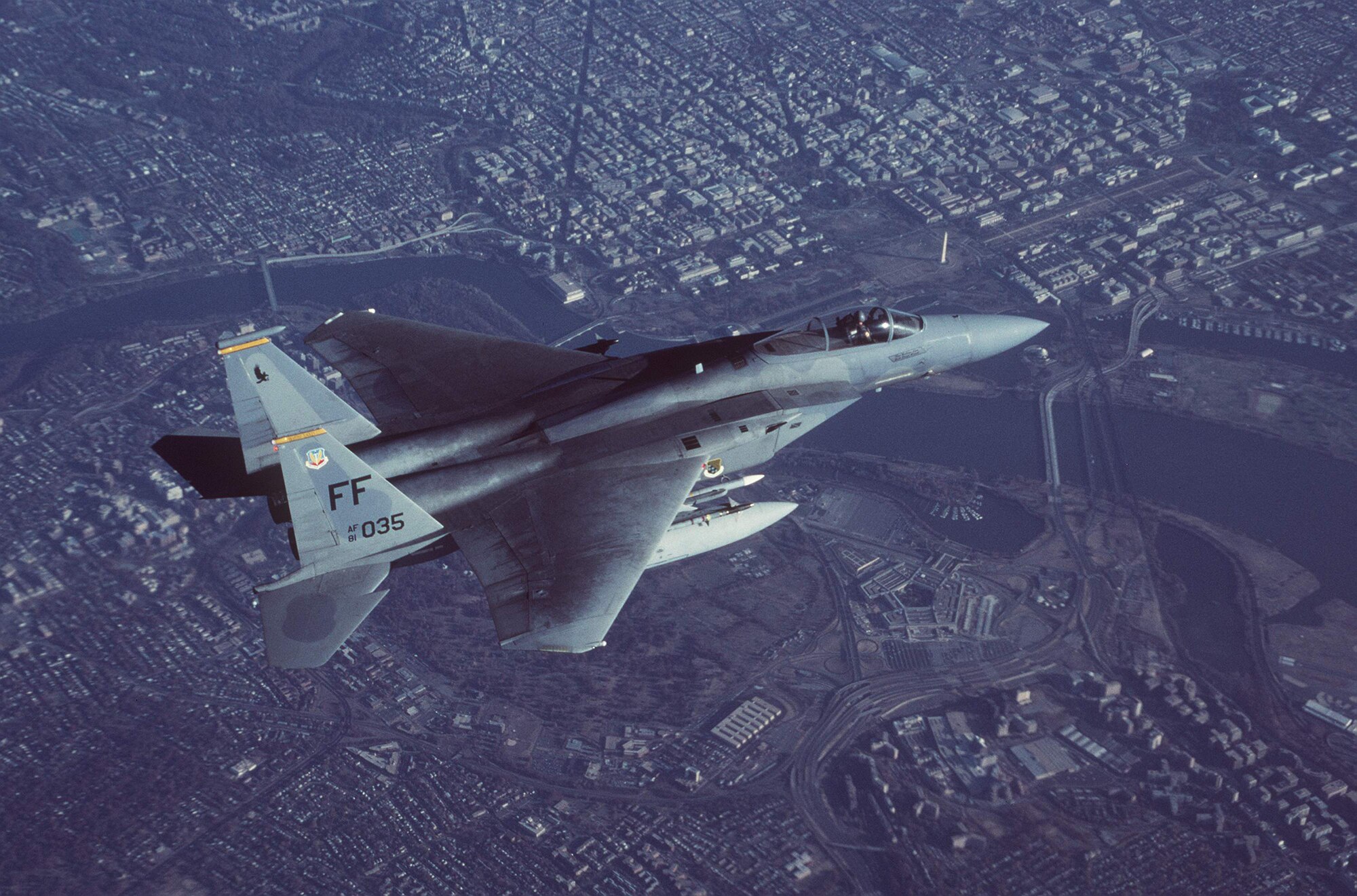 OPERATION NOBLE EAGLE -- An F-15C Eagle from  Langley Air Force Base, Va., flies over Washington during an early morning combat air patrol mission in support of Operation Noble Eagle. Operations Noble Eagle and Enduring Freedom are not only a joint U.S. campaign, they are combined campaigns. Coalition allies have flown nearly 1,000 missions, highlighting international resolve in the war on terrorism. NATO partners deployed forces to the US for the first time to help defend American air space. (U.S. Air Force photo by Staff Sgt. Greg L. Davis)