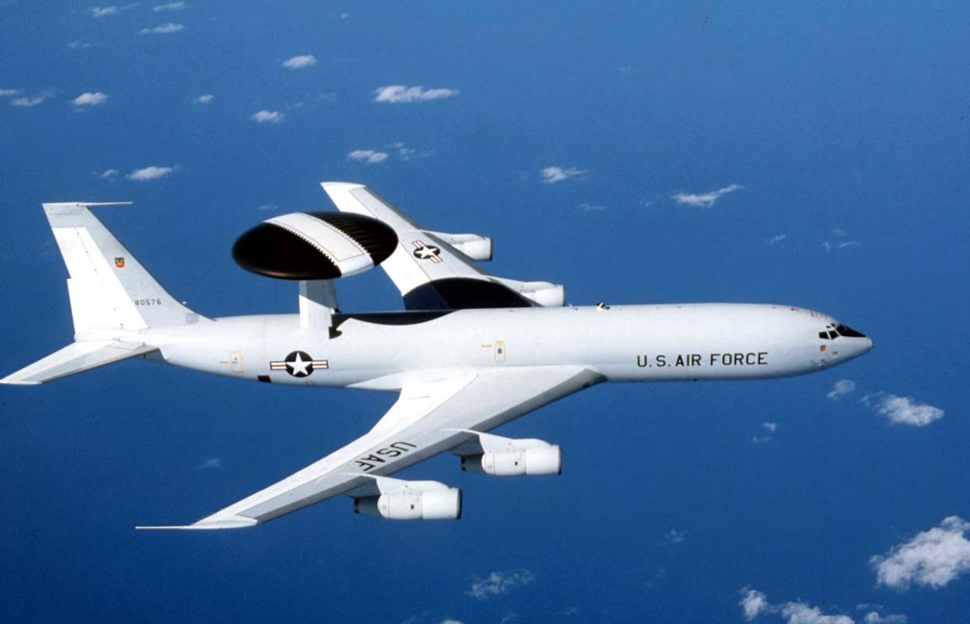 FILE PHOTO -- The E-3 Sentry is an airborne warning and control system aircraft that provides all-weather surveillance, command, control and communications needed by commanders of U.S. and NATO air defense forces. As proven in Desert Storm, it is the premier air battle command and control aircraft in the world today. The E-3 Sentry is a modified Boeing 707/320 commercial airframe with a rotating radar dome. The dome is 30 feet in diameter, six feet thick, and is held 11 feet above the fuselage by two struts. It contains a radar subsystem that permits surveillance fromthe Earth's surface up into the stratosphere, over land or water. The radar has a range of more than 200 miles  for low-flying targets and farther for aerospace vehicles flying at medium to high altitudes. The radar combined with an identification friend or foe subsystem can look down to detect, identify and track enemy and friendly low-flying aircraft by eliminating ground clutter returns that confuse other radar systems. (U.S. Air Force photo)