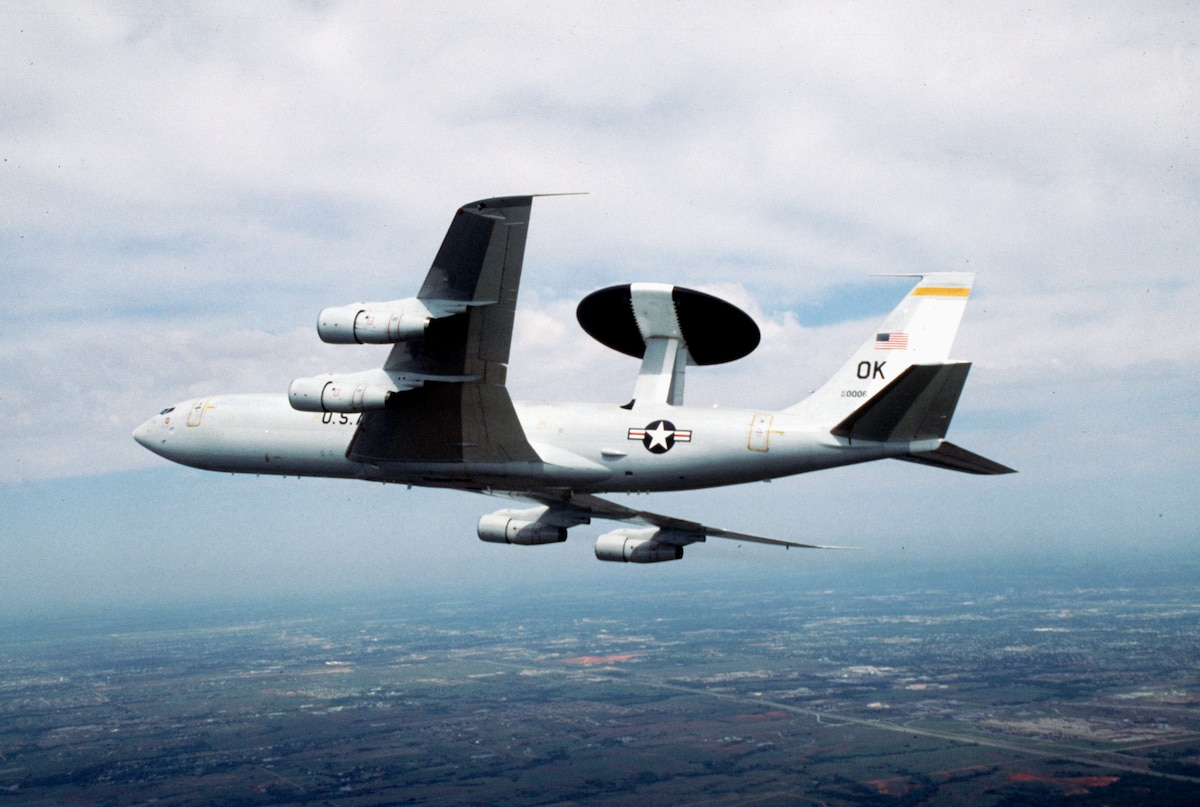 FILE PHOTO -- An E-3 Airborne Warning and Control System aircraft from Tinker Air Force Base, Okla., flies a mission. The E-3 Sentry is modified Boeing 707/320 commercial airframe with a rotating radar dome. The dome is 30 feet in diameter, 6 feet thick and is held 11 feet above the fuselage by two struts. It contains a radar subsystem that permits surveillance from the Earth's surface up into the stratosphere, over land or water. The radar has a range of more than 200 miles for low-flying targets and farther for aerospace vehicles flying at medium to high altitudes. (U.S. Air Force photo by Tech. Sgt. John K. McDowell)

