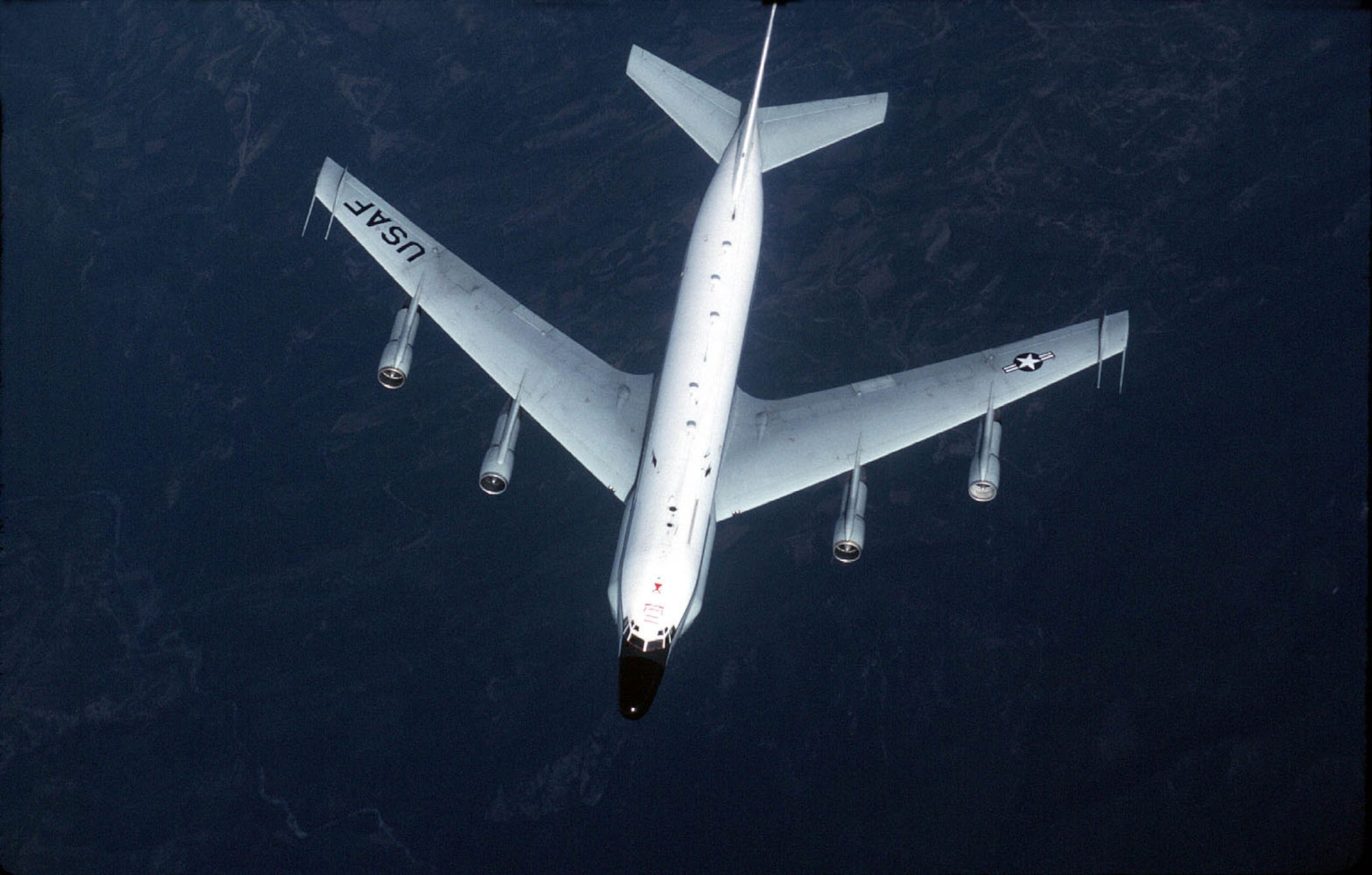 FILE PHOTO -- The basic airframe of the RC-135 resembles that of a slightly larger Boeing 707 from which it is derived. Having a long service career, RC-135s originally flew from remote bases in Alaska and elsewhere to collect data on Soviet ballistic missile testing during the Cold War. With the use of passive sensors, the RC-135 gathers imagery intelligence, telemetry intelligence and signals intelligence. (U.S. Air Force photo by Senior Airman Greg Davis) 
