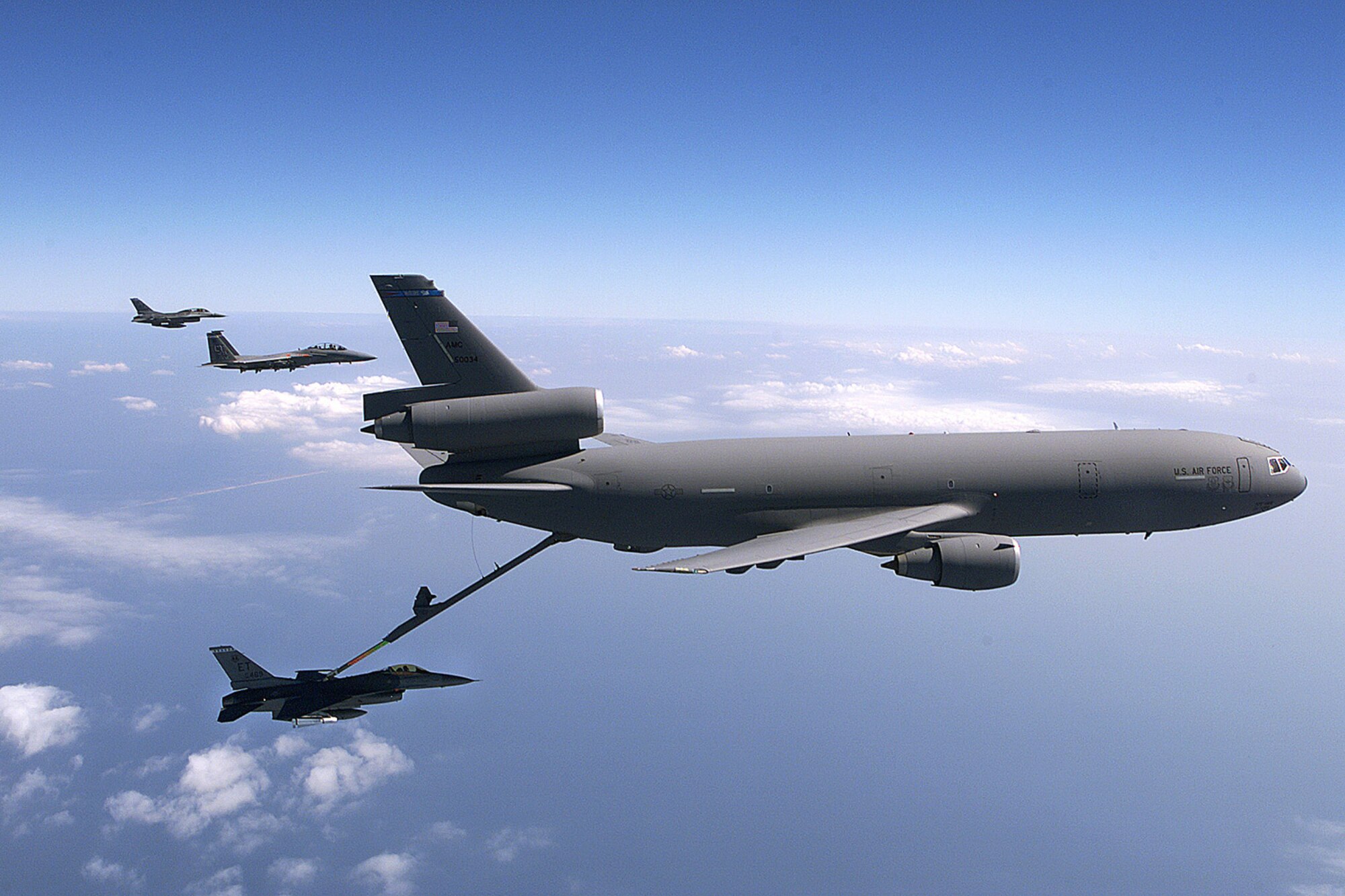 FILE PHOTO -- An F-16 Fighting Falcon from the 40th Flight Test Squadron, Eglin Air Force Base, Fla., refuels from a KC-10A Extender. The Extender is an Air Mobility Command advanced tanker and cargo aircraft designed to provide increased global mobility for U.S. armed forces.  (U.S. Air Force photo by  Staff Sgt. Jerry Morrison)