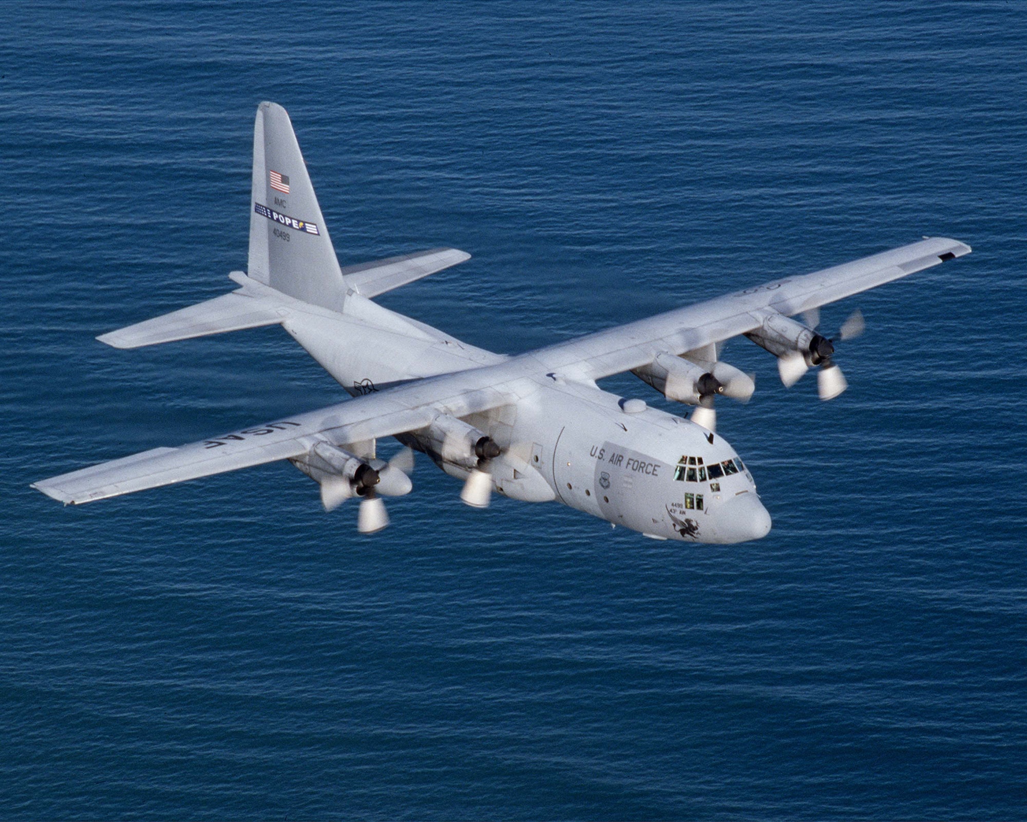 OVER THE ATLANTIC OCEAN -- A C-130 Hercules from the 2nd Airlift Squadron, Pope Air Force Base, N.C., flies over the Atlantic Ocean. The C-130 Hercules primarily performs the intratheater portion of the airlift mission. The aircraft is capable of operating from rough, dirt strips and is the prime transport for paradropping troops and equipment into hostile areas. (U.S. Air Force photo by Tech. Sgt. Howard Blair) 
