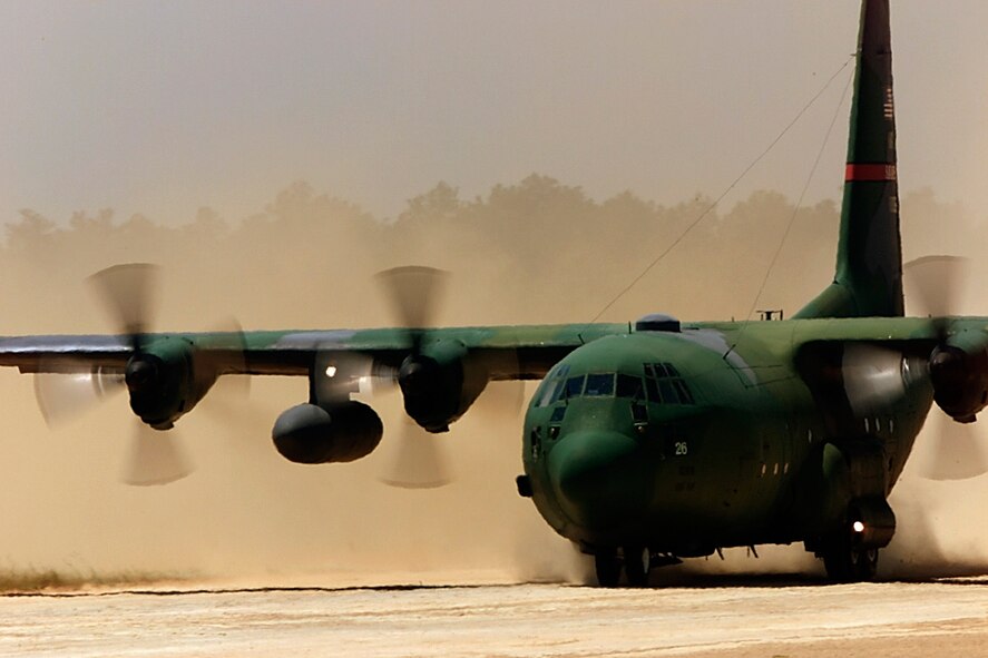 A C-130 Hercules from the 165th Air Wing, Savannah Ga., performs an assault landing on a dirt landing strip in preparation for a past Rodeo competition. During Rodeo, teams from all over the world compete in areas including airdrop, aerial refueling, aircraft navigation, special tactics, short field landings, cargo loading, engine running on/offloads, aeromedical evacuations and security forces operations. (U. S. Air Force photo by Staff Sgt. Jeffrey Allen) 
