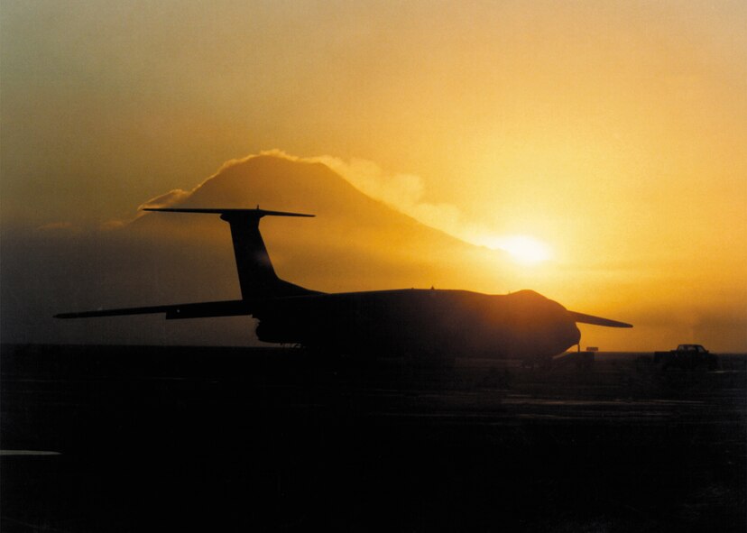 MCCHORD AIR FORCE BASE, Wash. -- A C-141 is silhouetted against Mount Rainier.  The 8th Airlift Squadron flew Starlifters from here for 35 years before transitioning to C-17 Globemaster IIIs.  (U.S. Air Force photo)
