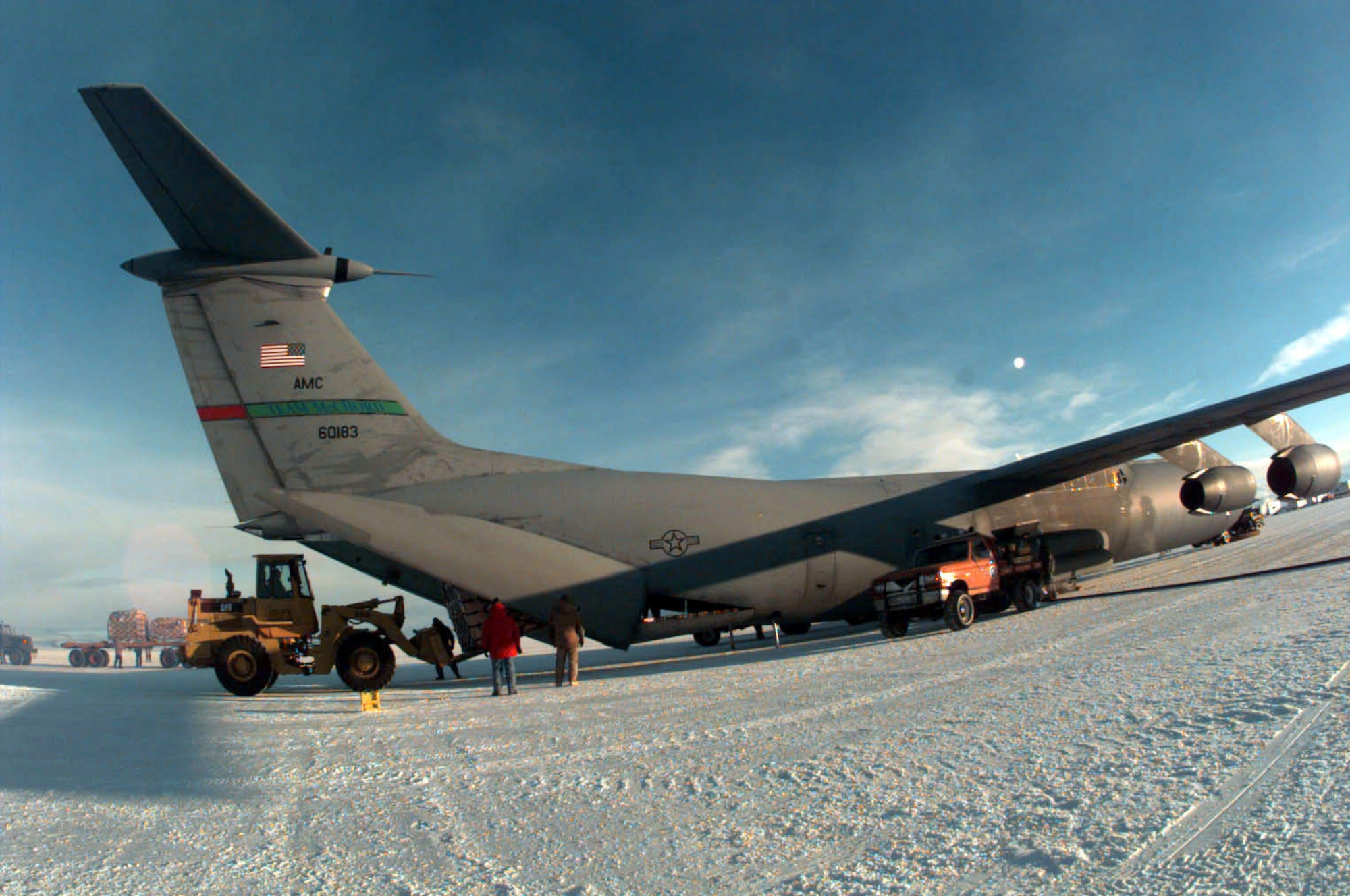 MCMURDO STATION, Antarctica -- In this 1997 photo, cargo is offloaded from a C-141B Starlifter from McChord Air Force Base, Wash., while parked on a runway of ice here. The cargo and passengers transported by C-141s as part of Operation Deep Freeze were flown from New Zealand to Antarctica in support of scientific research at McMurdo and the South Pole. (U.S. Air Force photo)