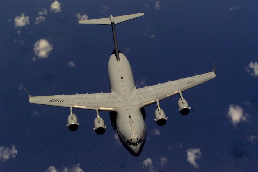 NORTH CAROLINA -- A C-17 Globemaster III from the 437th Air Wing, Charleston Air Force Base, S.C., flies away from a KC-10 Extender after being refueled off the coast of North Carolina.  During Rodeo 2000, teams from all over the world will compete in areas including airdrop, aerial refueling, aircraft navigation, special tactics, short field landings, cargo loading, engine running on/offloads, aeromedical evacuations and security forces operations. (U.S. Air Force photo by Staff Sgt. Sean M. Worrell)
