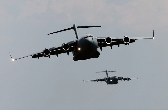 FILE PHOTO -- A flight of  C-17 Globemaster IIIs from the 437th Air Wing, Charleston Air Force Base, S.C., practices troop-drop procedures prior to picking up paratroopers from the 82nd Airborne Division Fort Bragg, N.C. on July 15, 2000.  An international mix of 172 paratroopers are flying directly from Fort Bragg to the Ukraine are jumping in support of exercise Peace Shield 2000. Peace Shield is a Partnership for Peace exercise involving 22  countries. (U.S. Air Force photo by Tech. Sgt. Jim Varhegyi)