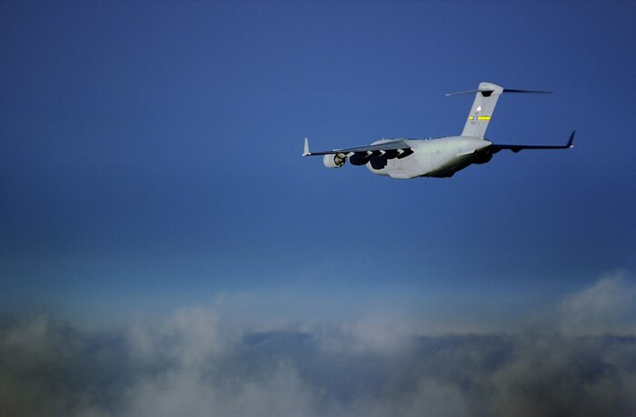 OVER THE ATLANTIC OCEAN -- A C-17 Globemaster III from the 437th Airlift Wing, Charleston Air Force Base, S.C., flys to the Ukraine loaded with 82nd Airborn Division Paratroopers July 16, 2000. Paratroopers are jumping in the Ukraine to support the exercise Peace Shield 2000. Peace Shield is a Joint Peace Keeping exercise involving 22 different countries. (U.S. Air Force photo by Staff Sgt. Jeffrey Allen)