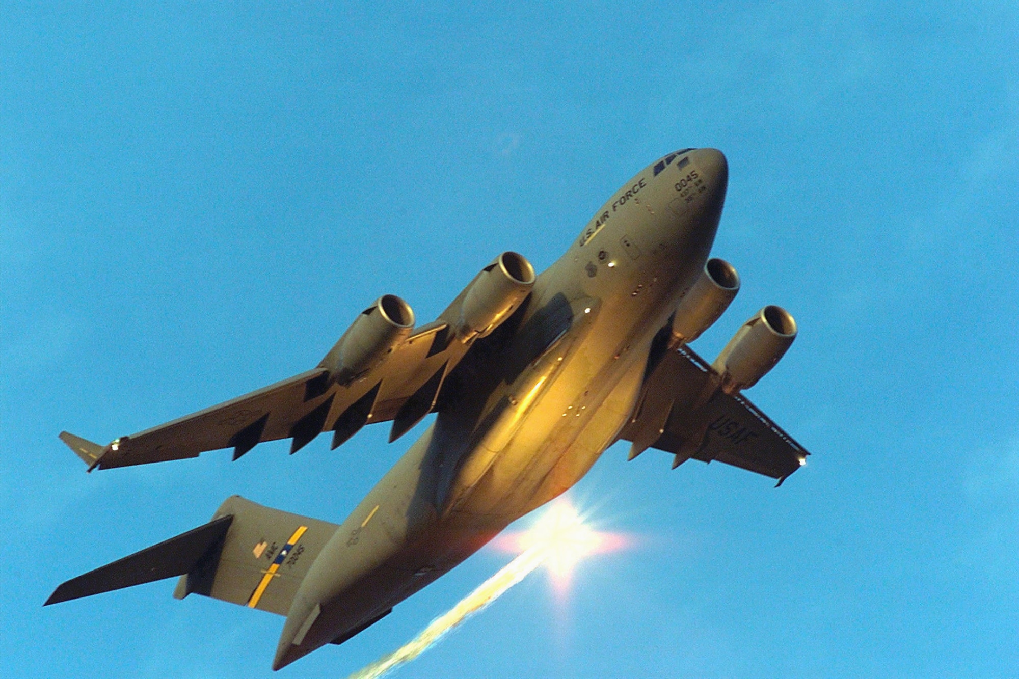 FILE PHOTO -- A C-17 Globemaster III practices evasive maneuvers during a simulated missile attack. (U.S. Air Force photo by Senior Airman Rick Bloom)
