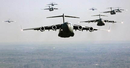 OVER NORTH FIELD, S.C. -- A C-17 Globemaster III from Charleston AFB, S.C., leads a formation Jan. 12, 2000.  The C-17 is part of a nine-ship formation flying a training mission that includes an air drop, a short field landing and aerial refueling. (U.S. Air Force photo by Staff Sgt. Jeffrey Allen)