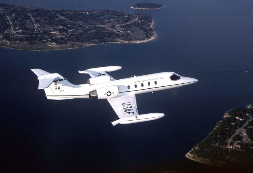 FILE PHOTO -- The C-21A provides cargo and passenger airlift and can transport litters during medical evacuations. The C-21A's turbofan engines are pod-mounted on the sides of the rear fuselage. The swept-back wings have hydraulically actuated, single-slotted flaps. The aircraft has a retractable tricycle landing gear, single steerable nose gear and multiple-disc hydraulic brakes. The C-21A can carry eight passengers and 42 cubic feet (1.26 cubic meters) of cargo. The fuel capacity of the C-21A is 931 gallons (3,537.8 liters) carried in wingtip tanks. The safety and operational capabilities of the C-21A are increased by the autopilot, color weather radar and tactical air navigation (TACAN) system, as well as HF, VHF and UHF radios. Delivery of the C-21A fleet began in April 1984 and was completed in October 1985. Glasco, a subsidiary of Learjet, Inc., provides full contractor logistics support at 16 worldwide locations. (U.S. Air Force photo)
