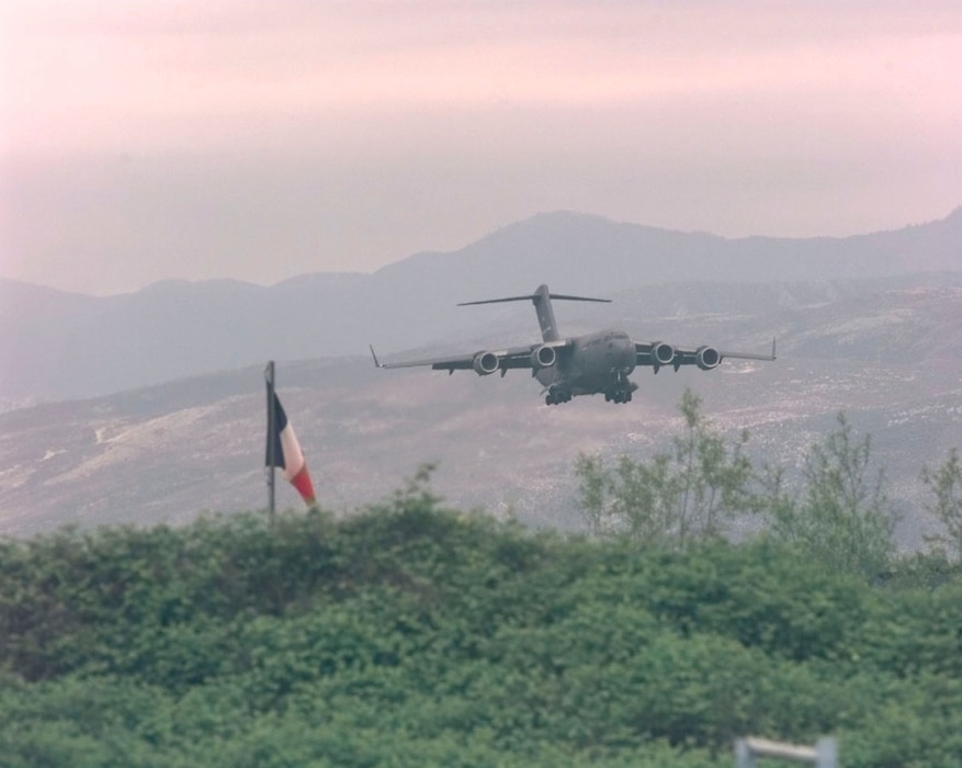 A U.S. Air Force C-17 Globemaster III from Joint Base Charleston makes its final approach to Rinas Airport in Albania during operation SHINING HOPE, April 23, 1999. Medical Airmen provided humanitarian support for ethnic Albanian refugees fleeing Kosovo.  (U.S. Air Force photo by Tech. Sgt. Cesar Rodriguez)