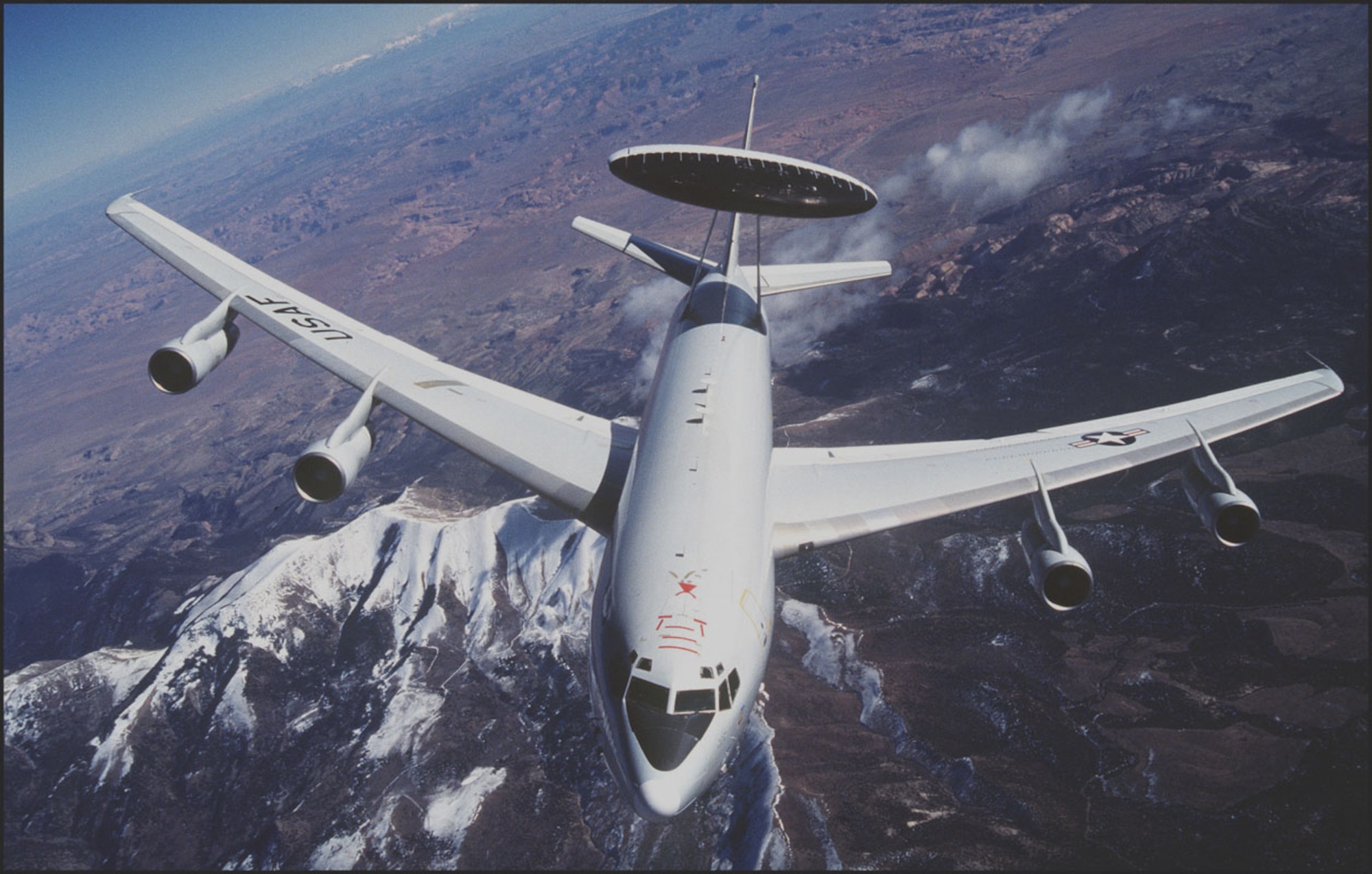 FILE PHOTO -- The E-3 Sentry is a modified Boeing 707/320 commercial airframe with a rotating radar dome. The dome is 30 feet in diameter, 6 feet thick and is held 11 feet above the fuselage by two struts. It contains a radar subsystem that permits surveillance from the Earth's surface up into the stratosphere, over land or water. The radar has a range of more than 200 miles for low-flying targets and farther for aerospace vehicles flying at medium to high altitudes. (Courtesy photo)