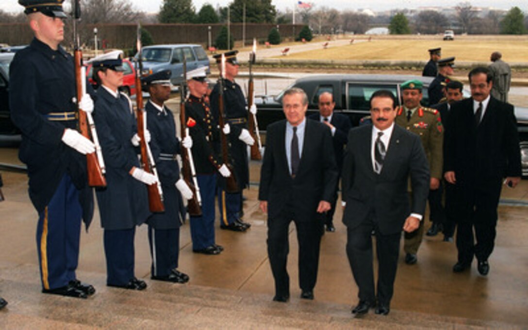 Secretary of Defense Donald H. Rumsfeld (left) escorts King Hamad bin Isa Al Khalifa of Bahrain through an honor cordon and into the Pentagon on Feb. 4, 2003. The two men will meet to discuss a range of bilateral and regional security issues. 
