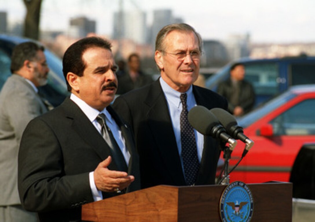 King Hamad bin Isa Al Khalifa (left) of Bahrain responds to a reporter's question during joint press availability with Secretary of Defense Donald H. Rumsfeld (right) outside the Pentagon on Feb. 4, 2003. The two men met earlier to discuss a range of bilateral and regional security issues. 