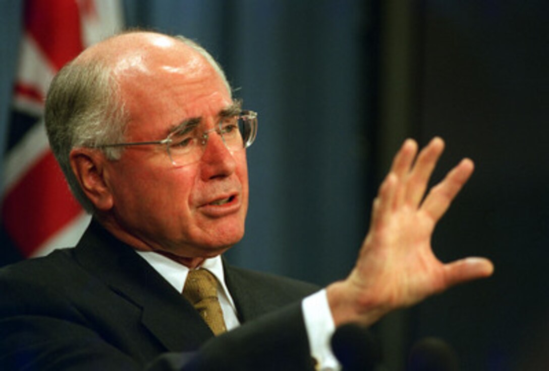 Australian Prime Minister John Howard responds to a reporter's question during a joint press conference with Secretary of Defense Donald H. Rumsfeld in the Pentagon on Feb. 4, 2003. Howard and Rumsfeld met earlier discuss a range of bilateral security issues including the situation in Iraq. 