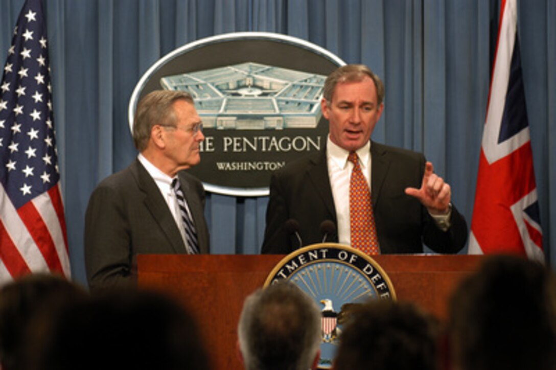 Britain's Secretary of State for Defence Geoffrey Hoon (right) comments on his country's view of going to war in Iraq without a United Nations' resolution specifically authorizing military action during a joint press conference with Secretary of Defense Donald H. Rumsfeld (left) in the Pentagon on Feb. 12, 2003. Hoon and Rumsfeld met earlier to discuss the war on terror and the situation with Iraq. 