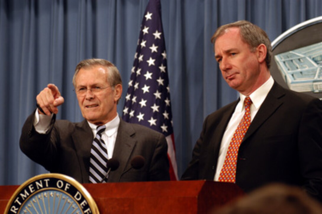 Secretary of Defense Donald H. Rumsfeld acknowledges a reporter during a joint press conference with Britain's Secretary of State for Defence Geoffrey Hoon in the Pentagon on Feb. 12, 2003. Rumsfeld and Hoon met earlier to discuss the war on terror and the situation with Iraq. 