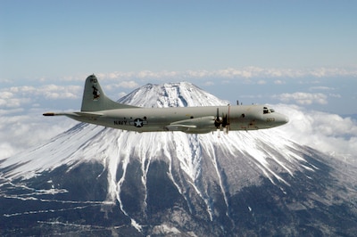 Misawa, Japan (Feb. 13, 2003) -- A P-3C Orion assigned to the Golden Eagles of Patrol Squadron Nine (VP-9) circles Mt. Fuji.  VP-9 is forward deployed to Misawa, Japan.