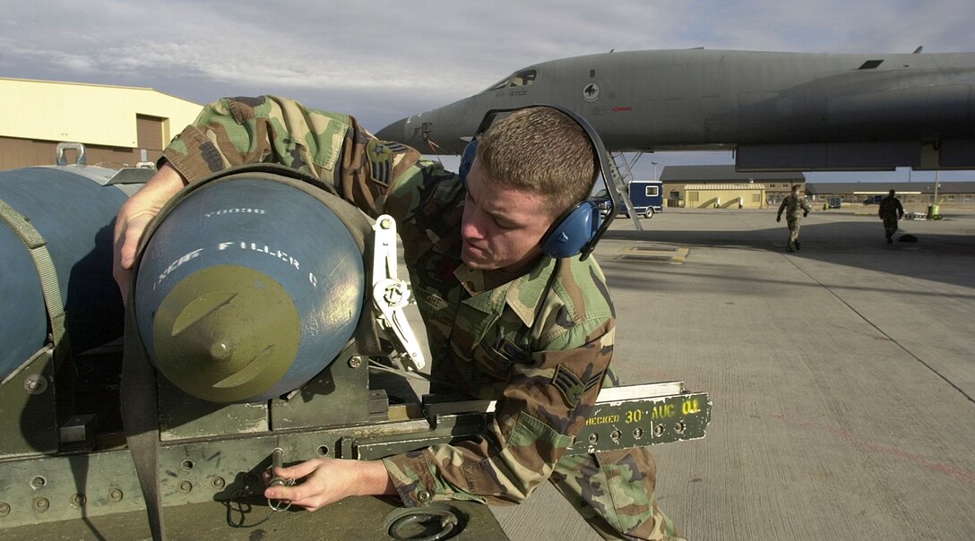 ELLSWORTH AIR FORCE BASE, S.D. -- Senior Airman Phillip Knight from Sunnyvale, Calif., a weapons loader with the 77th Bomb Squadron, here prepares an inert 2,000 pound Joint Direct Attack Munition.  JDAMs use the global positioning system for precision guidance. Iraq and other potential adversaries may have the ability to jam GPS signals, but Air Force war planners are not too worried about the effect of jamming on precision munitions (U.S. Air Force photo by Master Sgt. Dave Nolan)