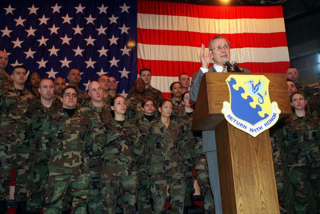 Secretary of Defense Donald H. Rumsfeld addresses the audience assembled for a town hall meeting at Aviano Air Base, Italy, on Feb. 7, 2003. Rumsfeld fielded questions from the audience of members of the U.S. Air Force 31st Fighter Wing. Rumsfeld is visiting Aviano after meetings in Rome with Italian Prime Minister Berlusconi and Minister of Defense Martino. 