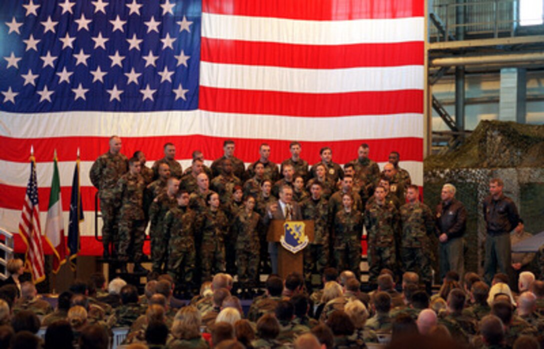 Secretary of Defense Donald H. Rumsfeld addresses the audience assembled for a town hall meeting at Aviano Air Base, Italy, on Feb. 7, 2003. Rumsfeld fielded questions from the audience of members of the U.S. Air Force 31st Fighter Wing. Rumsfeld is visiting Aviano after meetings in Rome with Italian Prime Minister Berlusconi and Minister of Defense Martino. 