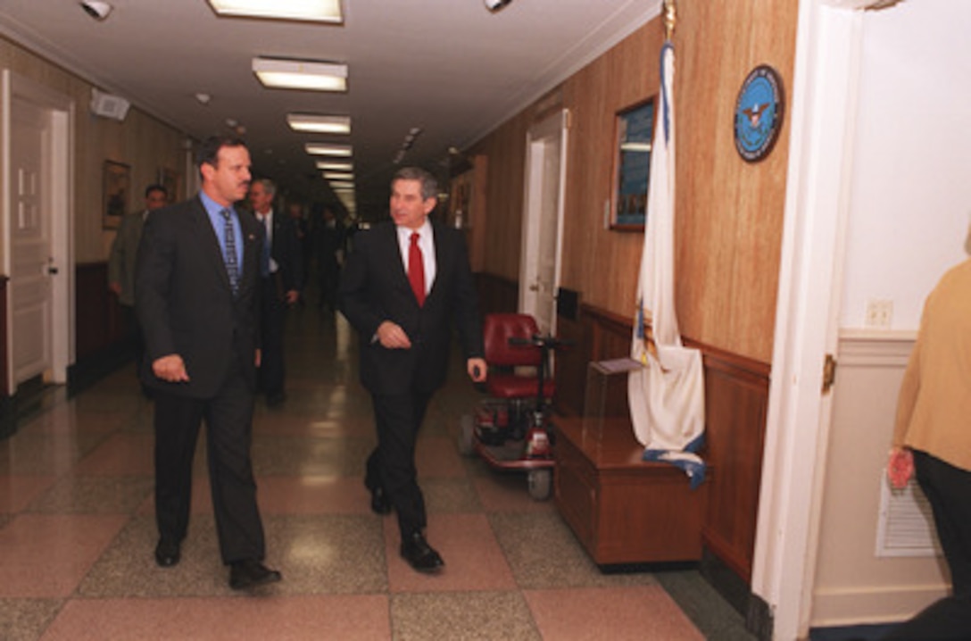 Deputy Secretary of Defense Paul D. Wolfowitz (right) escorts Prince Faisal Ben Hussein, of Jordan, in the Pentagon on Dec. 18, 2002. The Prince and Wolfowitz will meet to discuss national and international security interests. 