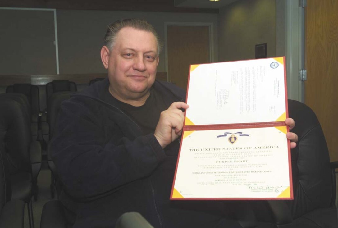 John W. Loomis Sr., a retired gunnery sergeant, was awarded a Purple Heart Friday in the Commanding Officer?s conference room for wounds he received in Vietnam more than 40 years ago. Loomis deployed to Vietnam three times during his career in the Marine Corps.