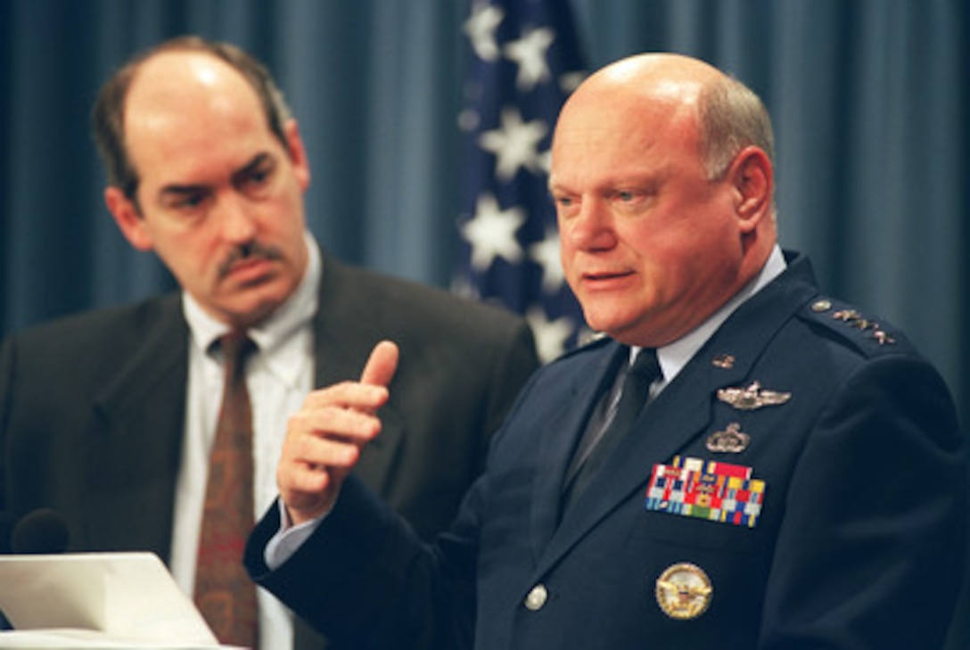 Lt. Gen. Ronald Kadish, U.S. Air Force, director of the Missile Defense Agency, explains some of the recent advances in U.S. anti-missile technology to reporters during a Dec. 17, 2002, Pentagon press briefing. Joining Kadish at the lectern is Assistant Secretary of Defense for International Security Policy J. D. Crouch (left). Their briefing was held as a follow-up to a White House announcement that President George W. Bush has directed the Department of Defense to begin fielding an initial defensive capability against hostile missiles. 