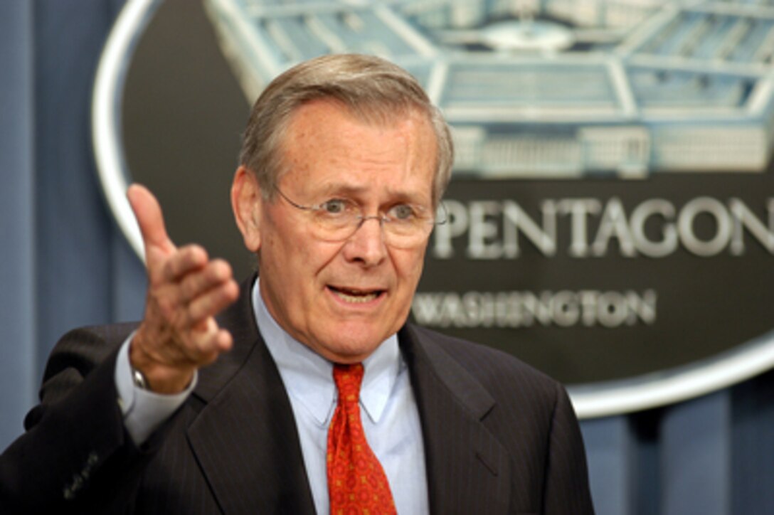 Secretary of Defense Donald H. Rumsfeld tries to explain the role of the United Nations weapons inspectors to reporters during a Pentagon press briefing on Jan. 15, 2003. Rumsfeld said, "They're not in there to discover things and find things - they're in there to inspect things that the Iraqi government decides to disclose to them." 