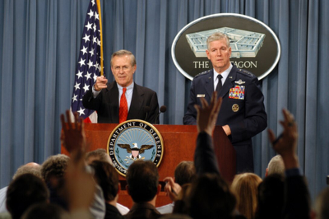 Secretary of Defense Donald H. Rumsfeld (left) recognizes a reporter for a question during a press briefing at the Pentagon on the Jan. 15, 2003. Chairman of the Joint Chiefs of Staff Gen. Richard B. Myers, U.S. Air Force, joined Rumsfeld at the briefing to update reporters. 