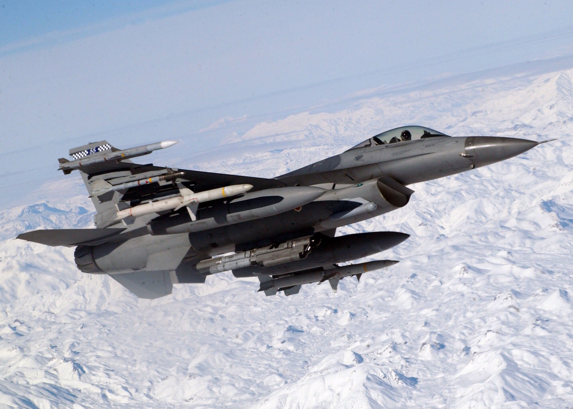 OPERATION NORTHERN WATCH -- An F-16 C/J Fighting Falcon of the 55th Expeditionary Fighter Squadron, Shaw Air Force Base, S.C., flies alongside a KC-135R Stratotanker during an Operation Northern Watch mission.  The aircraft and pilot are part of the 50 United Kingdom and U.S. aircraft and more than 1,400 U.K., Turkish and U.S. troops assigned to the Combined Task Force, Operation Northern Watch.  (U.S. Air Force photo by Staff Sgt. Jason Gamble)