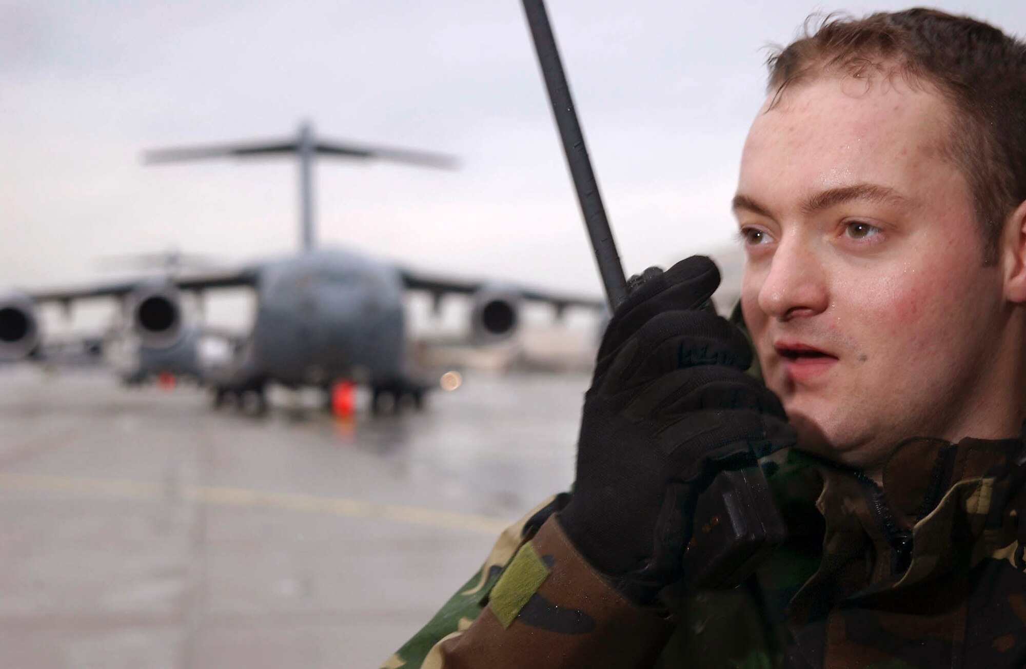 RHEIN-MAIN AIR BASE, Germany -- Airman 1st Class Nate Hill, a C-17 Globemaster III crew chief, updates the air mobility control center at Rhein-Main Air Base, Germany, on the status of his aircraft. Hill is assigned to the 437th Aircraft Maintenance Squadron at Charleston Air Force Base, S.C. He is currently on temporary duty at Rhein-Main. (U.S. Air Force photo by Master Sgt. Keith Reed)