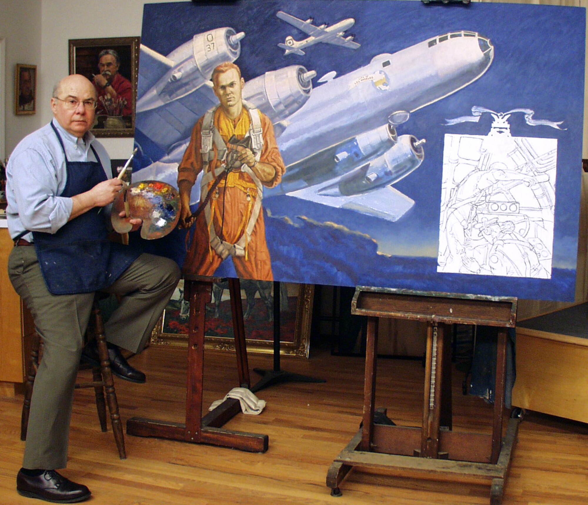 WASHINGTON -- Artist John Witt works on a painting featuring Staff Sgt. Henry "Red" Erwin, a World War II Medal of Honor recipient. Witt has been doing work for the Air Force Art Program since the early 1980s. (Courtesy photo)