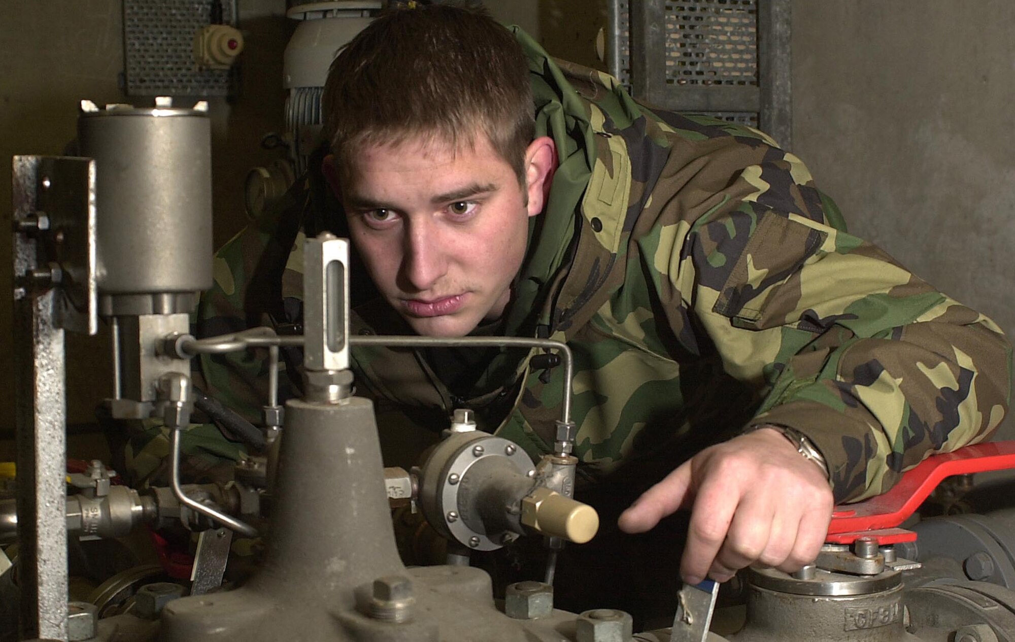 ROYAL AIR FORCE MILDENHALL, England -- Senior Airman Johnathan Seifert inspects a gauge that indicates the operational status of the fuel system. Seifert is assigned to the 100th Logistics Readiness Squadron's fuels management flight here. The flight provides nearly 33 million gallons of fuel annually to the 100th Air Refueling Wing's KC-135 Stratotankers, 352nd Special Operations Group aircraft and transient aircraft that visit the base. (U.S. Air Force photo by Tech. Sgt. Michael D. Morford)