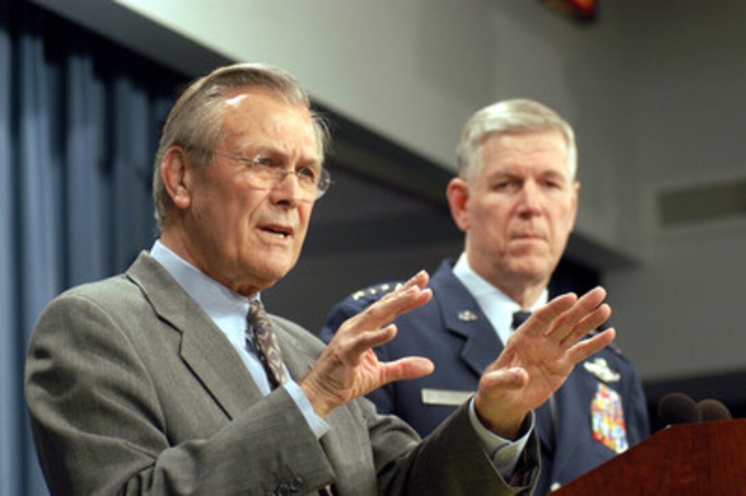 Secretary of Defense Donald H. Rumsfeld (left) answers a reporter's question concerning the situation with Iraq during a Pentagon press briefing on Jan. 29, 2003. Chairman of the Joint Chiefs of Staff Gen. Richard B. Myers (right), U.S. Air Force, joined Rumsfeld at the briefing to update reporters on current operations. 