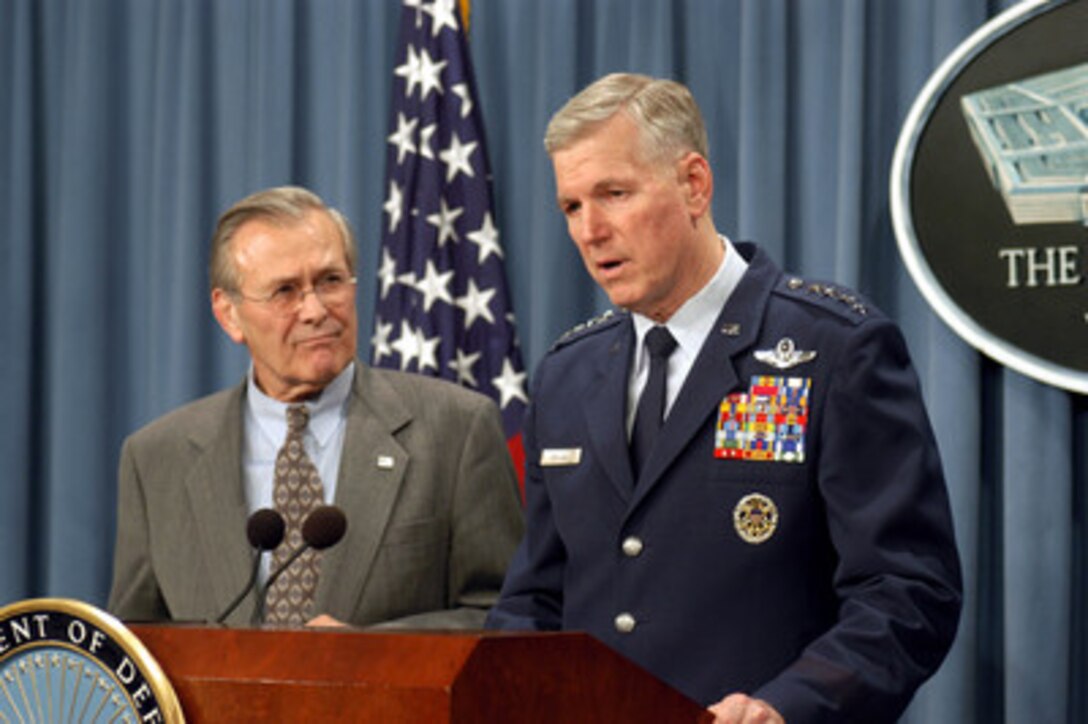 Chairman of the Joint Chiefs of Staff Gen. Richard B. Myers (right), U.S. Air Force, updates reporters on current operations during a Pentagon press briefing on Jan. 29, 2003. Secretary of Defense Donald H. Rumsfeld (left) joined Myers at the briefing to discuss the situation with Iraq with reporters. 
