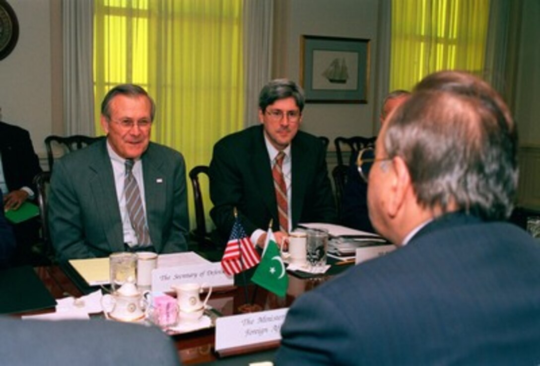 Secretary of Defense Donald H. Rumsfeld (left) meets with Pakistani Minister of Foreign Affairs Mian Khurshid Mahmud Kasuri (right) in the Pentagon on Jan. 27, 2003. The two men are meeting to discuss a range of bilateral security issues of interest to both nations. Also participating in the talks is Under Secretary of Defense for Policy Douglas Feith (center). 