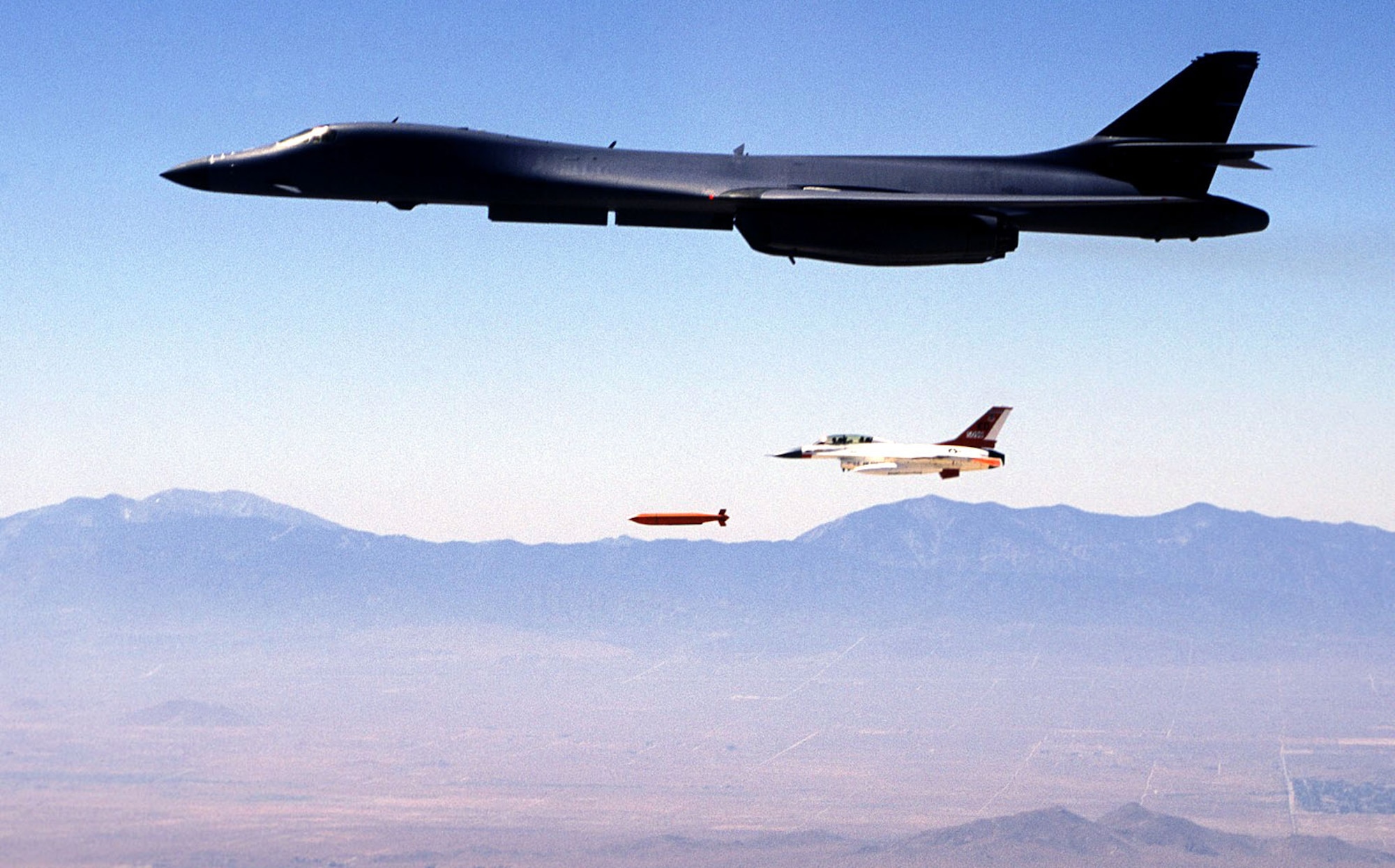 EDWARDS AIR FORCE BASE, Calif. -- A B-1B Lancer from the global power bomber combined test force here drops a Joint Standoff Weapon during a recent test mission.  The test marked the first time the JSOW has been dropped from the long-range bomber.  (U.S. Air Force photo by Steve Zapka)